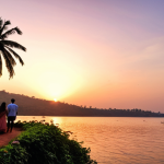**Dona Paula Sunset:** "Serene sunset at Dona Paula, Goa, with a couple enjoying the view by the tranquil lake. Romantic atmosphere, peaceful setting."